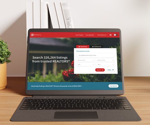 Photo of a laptop screen displaying the REALTOR.ca website homepage, with a property search bar and highlighted text reading ‘Search 326,264 listings from trusted REALTORS®’—showcasing a straightforward and accessible interface for real estate browsing.